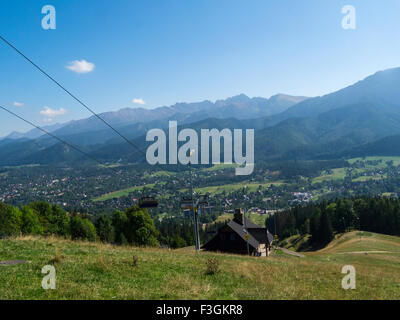 View down to Zakopane Poland and Tatra Mountains from Gubalowka Hill a popular tourist resort Southern Poland on lovely autumn September day Stock Photo