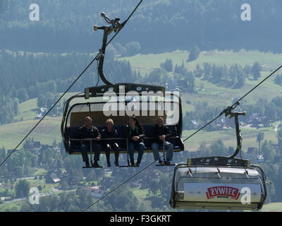 Tourists approaching top of Gubalowka Hill on Butorowy Wierch chair lift  Zakopane Poland a popular tourist resort in Southern Poland Stock Photo