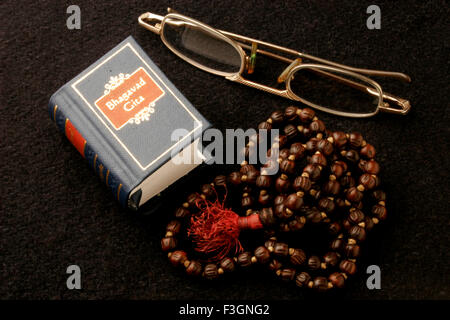 Indian sacred and epic book Bhagvad Gita in miniature form ; India Stock Photo