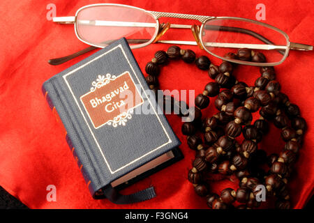Indian sacred and epic book Bhagvad Gita in miniature form ; India Stock Photo