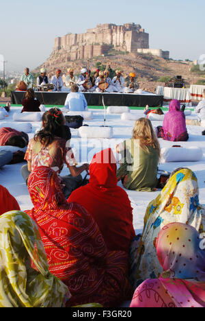 Ladies enjoying morning concert during Marwar festival ; Jodhpur ; Rajasthan ; India Stock Photo