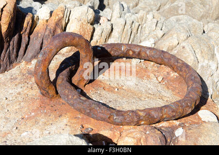 Rusty ring circle for anchor and boat Stock Photo