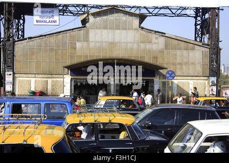 Mahalakshmi railway station & traffic on the road ; Bombay now Mumbai ; Maharashtra ; India Stock Photo