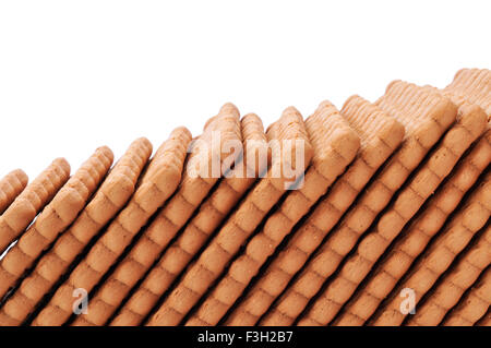 closeup of a line of rectangular cookies on a white background Stock Photo