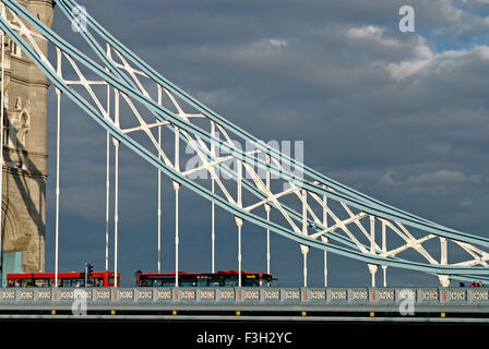 Bus passing on Tower Bridge over Thames river ; London ; U.K. United Kingdom England Stock Photo