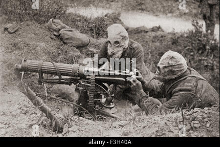 Machine gunners wearing masks to protect them from gas attacks during WWI. Stock Photo