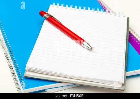 pen on the background of notebooks closeup Stock Photo