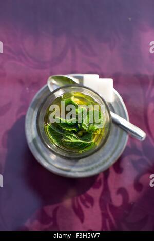Traditional fresh mint tea served in Marrakesh, Morocco. Stock Photo