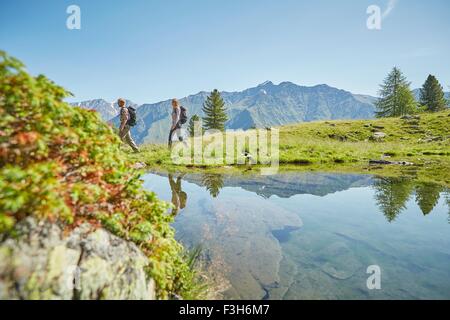 Young hiking couple near lake, Karthaus, Val Senales, South Tyrol, Italy Stock Photo