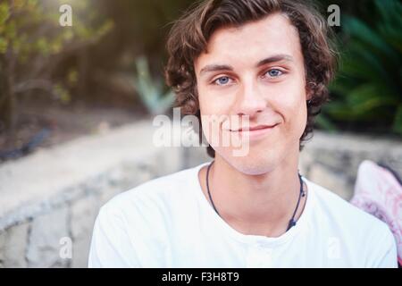 Portrait of young man on patio Stock Photo