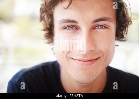 Close up portrait of young man with blue eyes