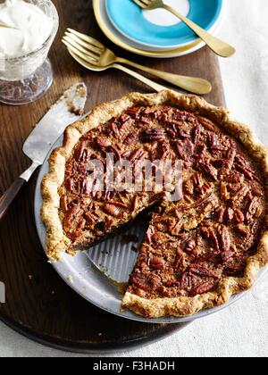 High angle view of pecan pie with slice missing Stock Photo