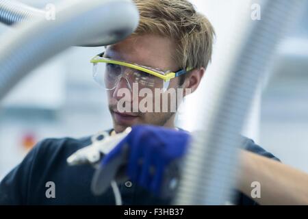 Factory technician working on network cables Stock Photo