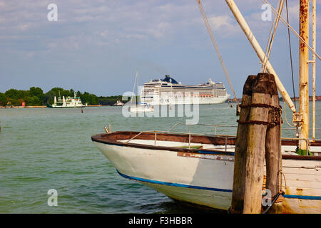 Cruise ship in Canale San Marco and old sailing boat moored on San Giorgio Maggiore island Venice Veneto Italy Europe Stock Photo