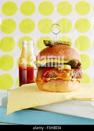 Still life of cheeseburger with retro background Stock Photo