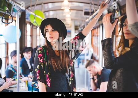 Young woman travelling on city tram Stock Photo