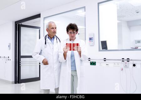 Two doctors looking at digital tablet Stock Photo