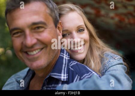 Portrait of mature man and young blond haired girlfriend Stock Photo