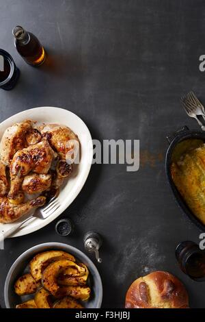 'Day of the Dead' food with roasted chicken and mole poblano sauce, acorn squash and enchiladas Stock Photo