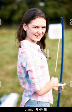 Portrait of teenage girl practicing archery Stock Photo