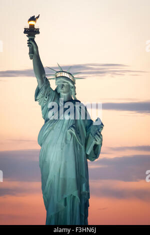 The Statue of Liberty at sunset in New York City, USA. Stock Photo
