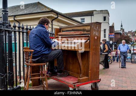 A Man Playing The Piano, High Street, Lewes, Sussex, UK Stock Photo