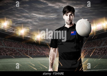 New Zealander rugby player, wearing a white unifrme in a stadium. Stock Photo