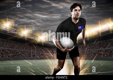 New Zealander rugby player, wearing a white unifrme in a stadium. Stock Photo
