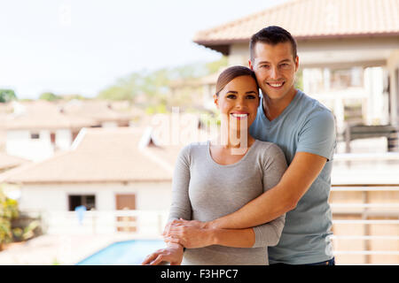 lovely young couple standing on balcony Stock Photo