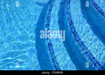 Light refractions in tiled swimming pool. Stock Photo