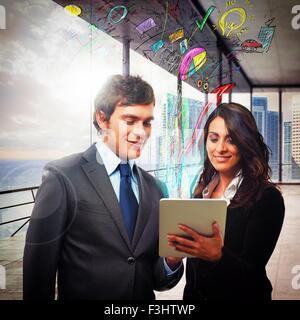 Analyze economy on tablet Stock Photo
