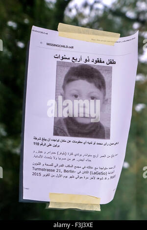 Berlin, Germany, 7th October 2014. Police believe that they have found the body of 4 year old Albanian refugee, Mohamed Januzi in a man's car. The young boy disappeared outside the Lageso centre on October 1st, 2015. Poster of missing child at the LaGeSo (Landesamt für Gesundheit und Soziales) centre Stock Photo