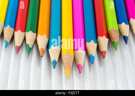 Colorful pencils on white cardboard.Creativity abstract Stock Photo