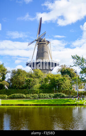 Windmill in Netherlands town Leiden. Idyllic day for being outdoors Stock Photo