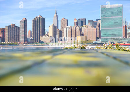 View at the Manhattan panorama over a wooden fense on a sunny day Stock Photo