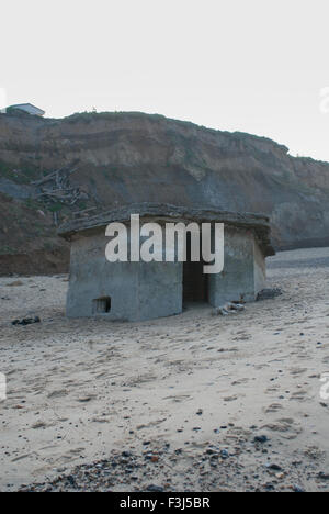 Old pill box on a deserted beach Stock Photo