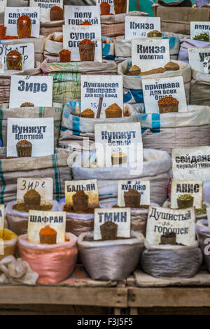 Vivid oriental central asian market with bags full of various spices in Osh bazar in Bishkek, Kyrgyzstan. Stock Photo