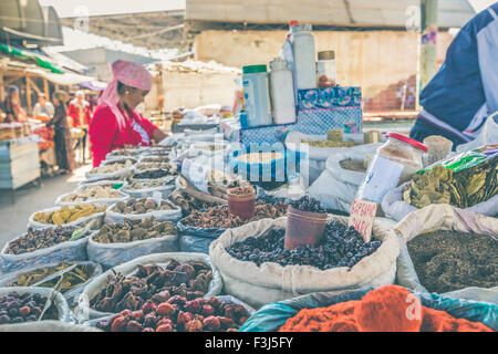 Vivid oriental central asian market with bags full of various spices in Osh bazar in Bishkek, Kyrgyzstan. Stock Photo