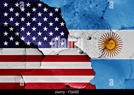 flags of United States and Argentina painted on cracked wall Stock Photo