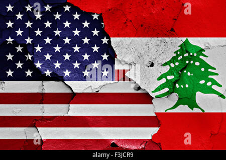 flags of United States and Lebanon painted on cracked wall Stock Photo