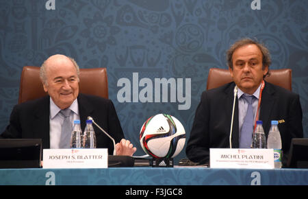 St.Petersburg, Russia. 25th July, 2015. FIFA President Joseph Blatter (L) smiles as he sits next to UEFA President Michel Platini (R) as they join a seminar ahead of the Preliminary Draw for the FIFA World Cup 2018, in St.Petersburg, Russia, 25 July 2015. Photo: MARCUS BRANDT/dpa/Alamy Live News Stock Photo