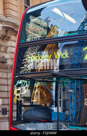 UK, London, Red London bus with reflection of St Pauls cathedral on ...