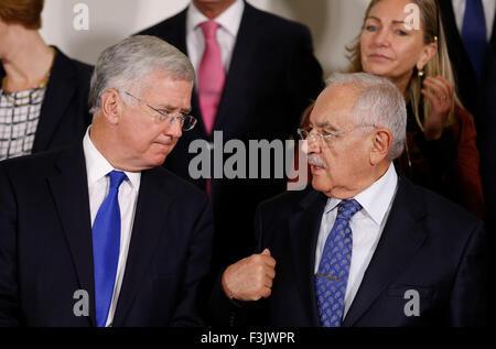 Brussels, Belgium. 8th Oct, 2015. British Defence Secretary Michael Fallon (L) talks with Turkey's Minister of Defense Mehmet Vecdi Gonul at family photo session during a NATO Defense Ministers meeting at its headquarters in Brussels, Belgium, Oct. 8, 2015. Credit:  Ye Pingfan/Xinhua/Alamy Live News Stock Photo