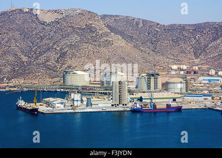 large boat load next to a refinery Stock Photo