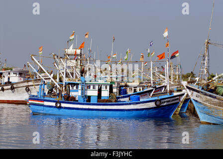 A fisherman in a country fishing boat full of fish at huge fishing yard ;  Udupi ; Karnataka ; India, Stock Photo, Picture And Rights Managed Image.  Pic. DPA-NMK-132602