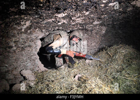 Khyber Agency. 8th Oct, 2015. A Pakistani soldier shows a hidden mine used by terrorists in northwestern Pakistan's Khyber Agency, Oct. 8, 2015. Huge amount of arms, ammunitions and explosives material were recovered over operation in Khyber Agency, officials said. Credit:  Umar Qayyum/Xinhua/Alamy Live News Stock Photo