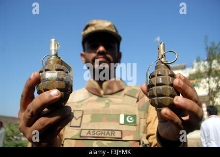 Khyber Agency. 8th Oct, 2015. A Pakistani soldier displays hand grenades recovered during an operation against terrorists in northwestern Pakistan's Khyber Agency, Oct. 8, 2015. Huge amount of arms, ammunitions and explosives material were recovered over operation in Khyber Agency, officials said. Credit:  Umar Qayyum/Xinhua/Alamy Live News Stock Photo