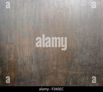 matt dark rusty flat metal surface background closeup Stock Photo