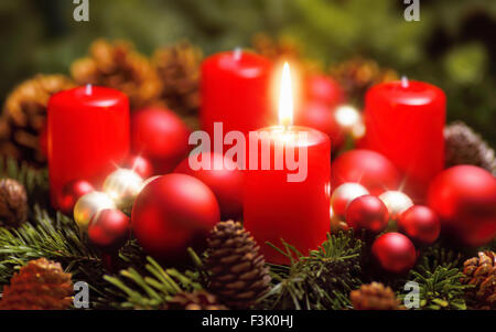 Studio shot of a nice advent wreath with baubles and one burning red candle Stock Photo