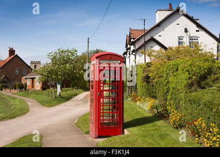 UK, England, Yorkshire East Riding, Sherburn, St Hilda’s Road, village green, phone box and water pump Stock Photo
